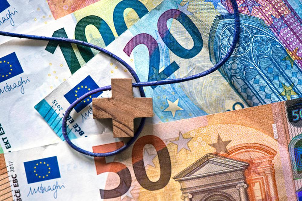 Kreuz auf Euro-Banknoten (Themenbild)
